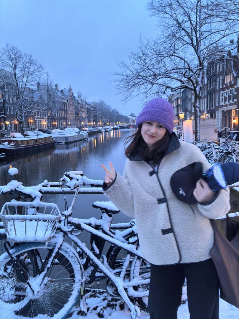 Konxhe on a snow-covered Amsterdam canal bridge in winter