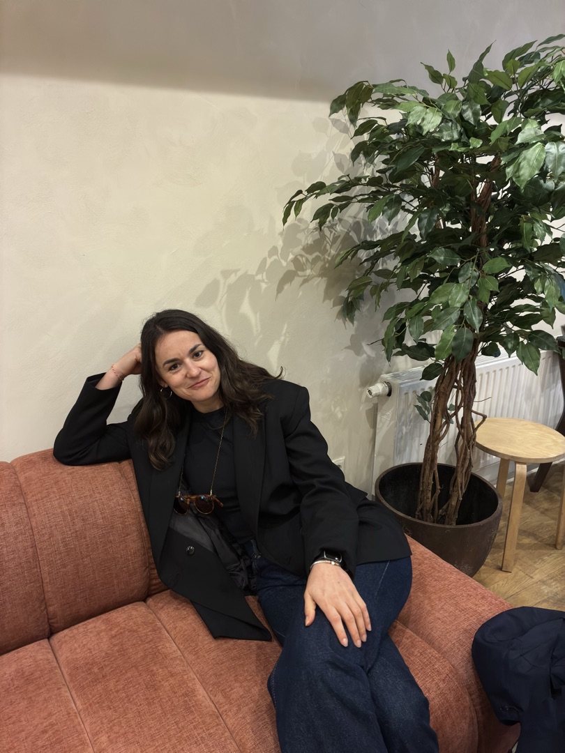 Konxhe relaxing on a sofa